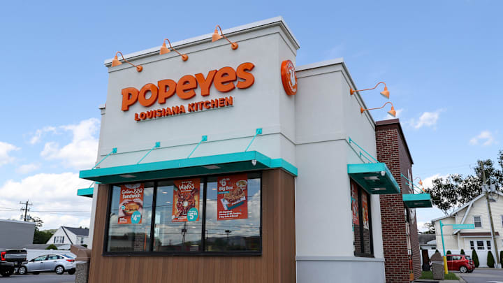 An exterior view of a Popeyes restaurant. Popeyes Louisiana...