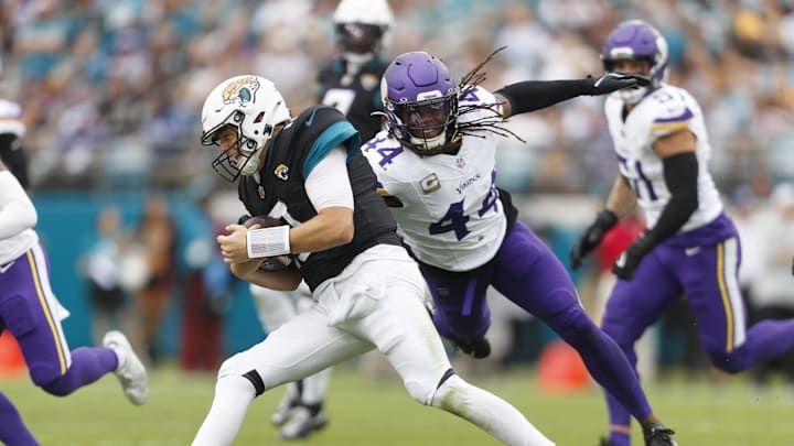 Nov 10, 2024; Jacksonville, Florida, USA; Jacksonville Jaguars quarterback Mac Jones (10) avoids a tackle from safety Joshua Metellus (44) during the during the second quarter at EverBank Stadium. 