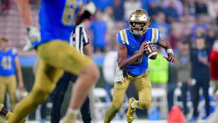 Nov 8, 2025; Pasadena, California, USA; UCLA Bruins quarterback Nico Iamaleava (9) runs the ball against the Nebraska Cornhuskers during the second half at the Rose Bowl. Mandatory Credit: Gary A. Vasquez-Imagn Images