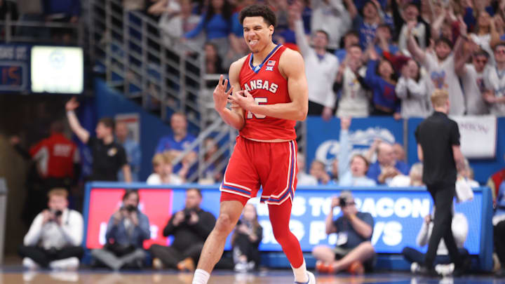 Kansas graduate senior guard Kevin McCullar Jr. (15) reacts after sinking a three against Kansas State in the first half of the Sunflower Showdown inside Allen Fieldhouse Tuesday, March 5, 2024.