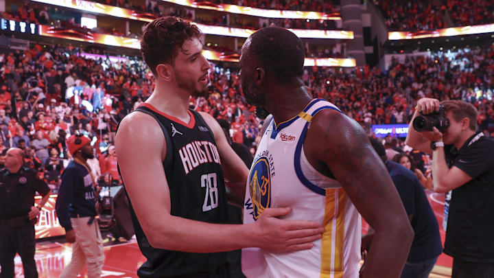 Dec 11, 2024; Houston, Texas, USA; Houston Rockets center Alperen Sengun (28) talks with Golden State Warriors forward Draymond Green (23) after the game at Toyota Center. Mandatory Credit: Troy Taormina-Imagn Images