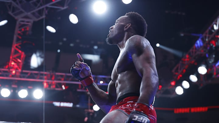 Aug 16, 2025; Chicago, Illinois, UNITED STATES; Lerone Murphy (red gloves) reacts after the fight against Aaron Pico (blue gloves) during UFC 319 at United Center. Mandatory Credit: Kamil Krzaczynski-Imagn Images