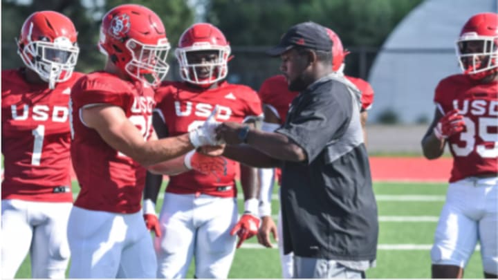 Miles Taylor coaches during a South Dakota football practice. 