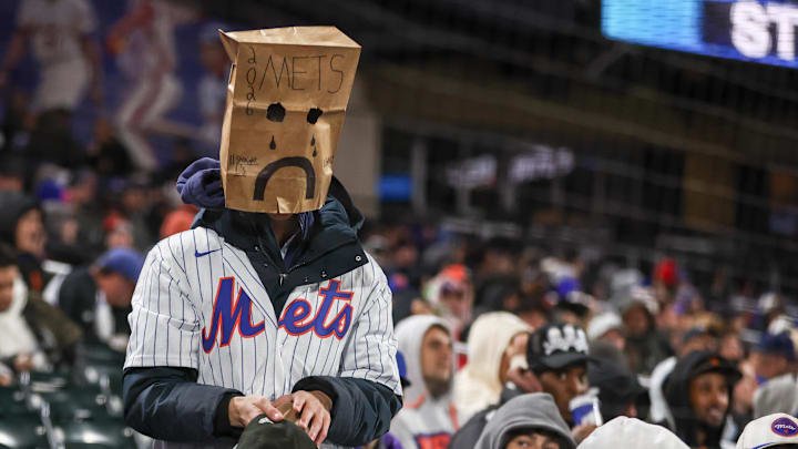 Apr 21, 2026; New York City, New York, USA;  A fan wears a bag in the eighth inning during a game between the Minnesota Twins and the New York Mets at Citi Field. Mandatory Credit: Wendell Cruz-Imagn Images