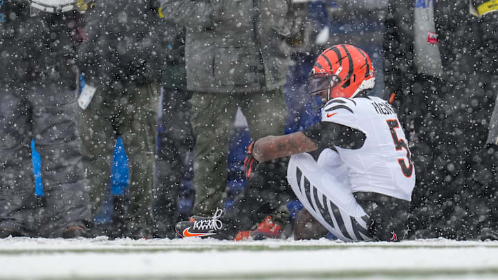 Cincinnati Bengals wide receiver Tee Higgins (5) waits for trainers after hitting his head on the ground on a catch in the second quarter of the NFL Week 14 game between the Buffalo Bills and the Cincinnati Bengals at Highmark Stadium in Orchard Park, N.Y., on Sunday, Dec. 7, 2025.