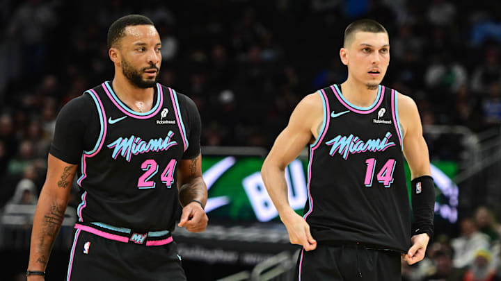 Feb 24, 2026; Milwaukee, Wisconsin, USA;  Miami Heat guard Norman Powell (24) and guard Tyler Herro (14) looks on in the third quarter against the Milwaukee Bucks at Fiserv Forum. Mandatory Credit: Benny Sieu-Imagn Images