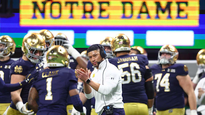 Jan 20, 2025; Atlanta, GA, USA; Notre Dame Fighting Irish head coach Marcus Freeman reacts after a play against the Ohio State Buckeyes during the second half of the CFP National Championship college football game at Mercedes-Benz Stadium. Mandatory Credit: Mark J. Rebilas-Imagn Images