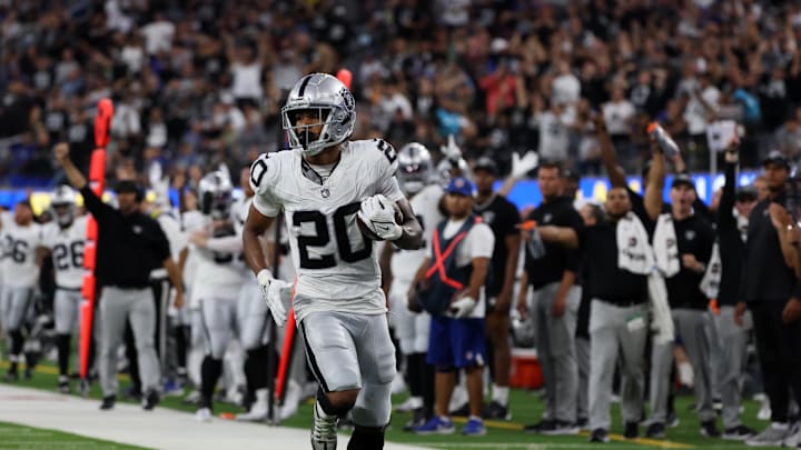 Aug 19, 2023; Inglewood, California, USA;  Las Vegas Raiders safety Isaiah Pola-Mao (20) runs for a touchdown after he intercepts a pass during the second quarter against the Los Angeles Rams at SoFi Stadium. Mandatory Credit: Kiyoshi Mio-Imagn Images