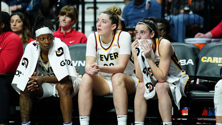 May 14, 2024; Uncasville, Connecticut, USA; Indiana Fever guard Caitlin Clark (22), forward Katie Lou Samuelson (33) and guard Erica Wheeler (17) on the bench against the Connecticut Sun in the first quarter at Mohegan Sun Arena. Mandatory Credit: David Butler II-Imagn Images May 14, 2024; Uncasville, Connecticut, USA; Indiana Fever guard Caitlin Clark (22), forward Katie Lou Samuelson (33) and guard Erica Wheeler (17) on the bench against the Connecticut Sun in the first quarter at Mohegan Sun Arena. Mandatory Credit: David Butler II-Imagn Images