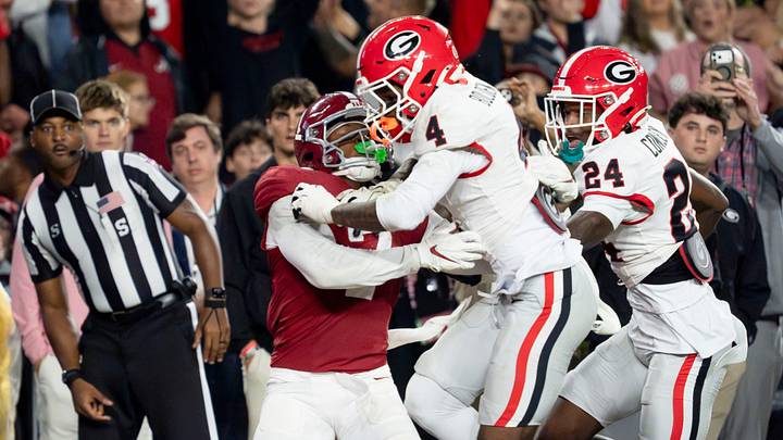 Oct 10, 2026; Tuscaloosa, Alabama, USA;  Georgia defensive back KJ Bolden (4) hits Alabama wide receiver Rico Scott (7) well before the ball arrives at Saban Field at Bryant-Denny Stadium. No penalty was called. Mandatory Credit: Gary Cosby Jr.-Imagn Images