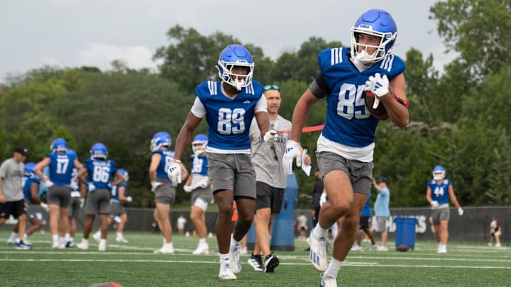 Kansas freshman wide receivers Tate Nagy (85) works with freshman Jackson Cook (89) during practice at the outdoor practice fields in Lawrence on July 24, 2025.