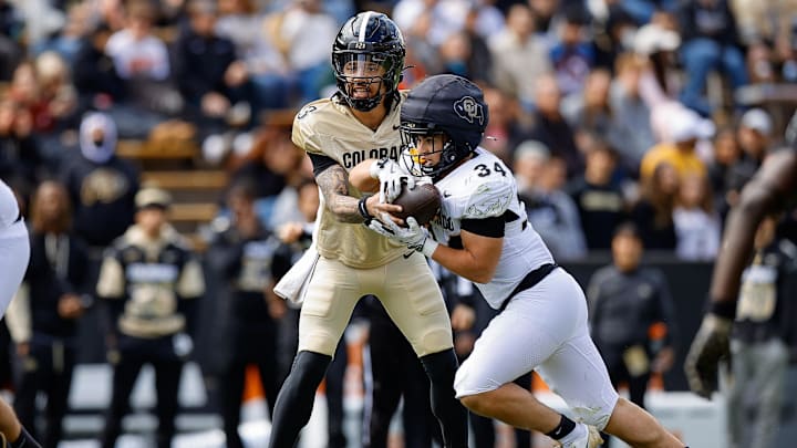 Apr 19, 2025; Boulder, CO, USA; Colorado Buffaloes quarterback Kaidon Salter (3) hands the ball off to running back Titus Bautista (34) during the spring game at Folsom Field. Mandatory Credit: Isaiah J. Downing-Imagn Images