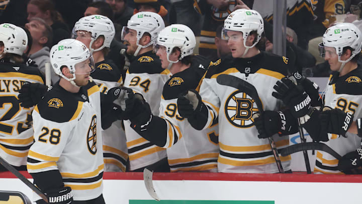 Apr 13, 2025; Pittsburgh, Pennsylvania, USA;  Boston Bruins center Elias Lindholm (28) celebrates his goal with the Boston bench against the Pittsburgh Penguins during the first period at PPG Paints Arena. Mandatory Credit: Charles LeClaire-Imagn Images