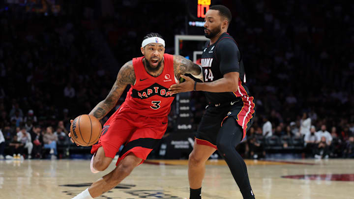 Dec 15, 2025; Miami, Florida, USA; Toronto Raptors forward Brandon Ingram (3) drives to the basket against Miami Heat guard Norman Powell (24) during the second quarter at Kaseya Center. Mandatory Credit: Sam Navarro-Imagn Images