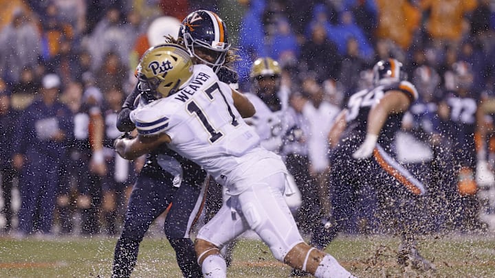 Nov 2, 2018; Charlottesville, VA, USA; Virginia Cavaliers quarterback Bryce Perkins (3) is tackled by Pittsburgh Panthers defensive lineman Rashad Weaver (17) in the first quarter at Scott Stadium. Mandatory Credit: Geoff Burke-Imagn Images