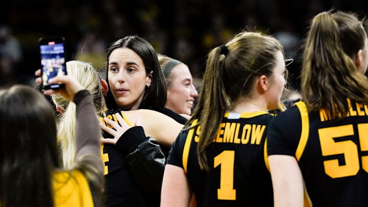 Caitlin Clark celebrates with the Hawkeyes womenÕs basketball team after they defeated the USC Trojans 76-69 during a Big Ten womenÕs basketball game Sunday, Feb. 2, 2025 at Carver-Hawkeye Arena in Iowa City, Iowa.