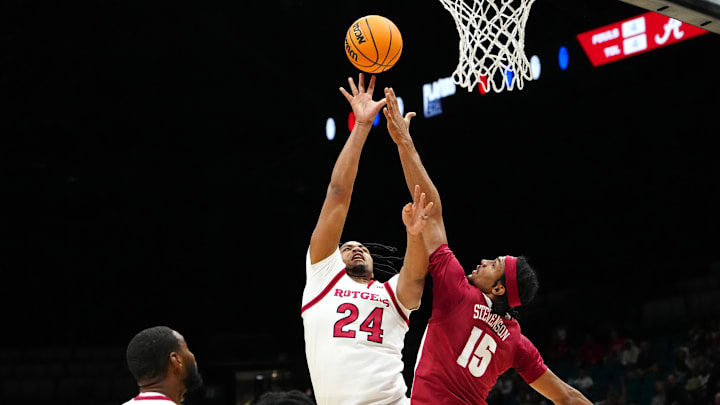 Nov 27, 2024; Las Vegas, Nevada, USA; Rutgers Scarlet Knights center Lathan Sommerville (24) shoots against Alabama Crimson Tide forward Jarin Stevenson (15) during the first half at MGM Grand Garden Arena. Mandatory Credit: Stephen R. Sylvanie-Imagn Images