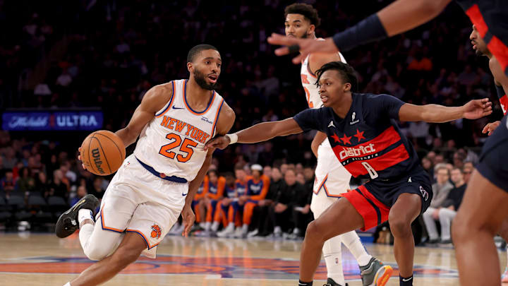 Nov 18, 2024; New York, New York, USA; New York Knicks forward Mikal Bridges (25) drives to the basket against Washington Wizards guard Carlton Carrington (8) during the third quarter at Madison Square Garden. Mandatory Credit: Brad Penner-Imagn Images