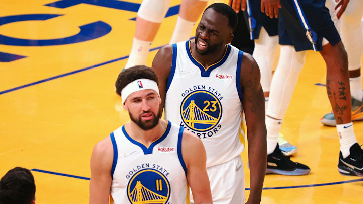 Golden State Warriors guard Klay Thompson (11) and forward Draymond Green (23) react after Thompson is called for a foul against the Dallas Mavericks during the second quarter of game two of the 2022 Western Conference Finals at Chase Center. Mandatory Credit: