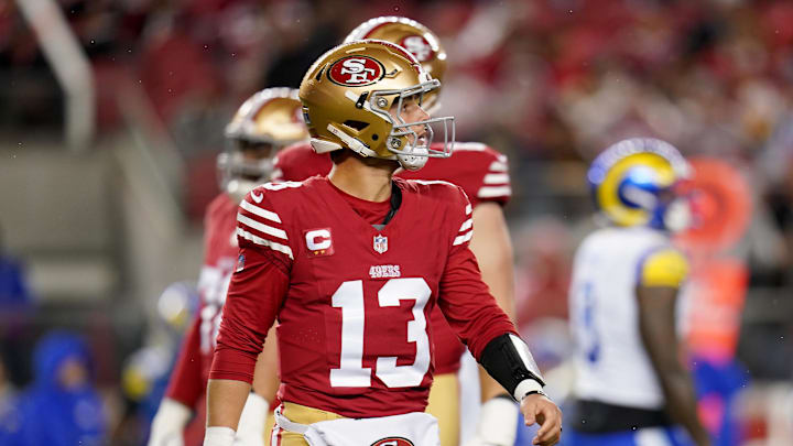 Dec 12, 2024; Santa Clara, California, USA; San Francisco 49ers quarterback Brock Purdy (13) walks towards the sidelines after throwing an incomplete pass against the Los Angeles Rams at Levi's Stadium. Mandatory Credit: Cary Edmondson-Imagn Images