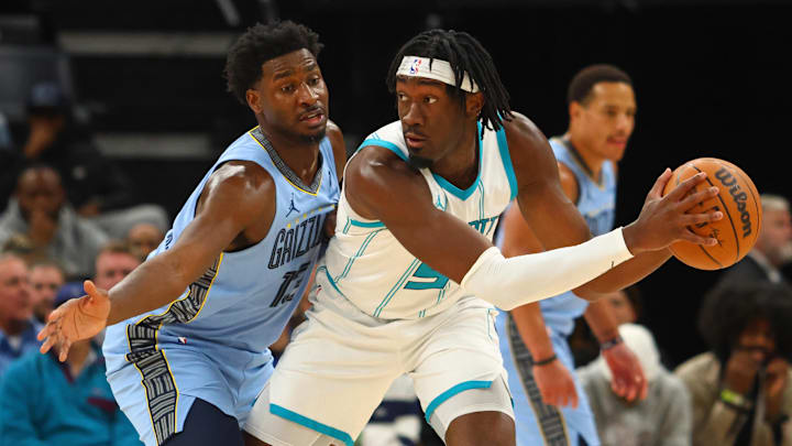 Jan 22, 2025; Memphis, Tennessee, USA; Charlotte Hornets center Mark Williams (5) handles the ball as Memphis Grizzlies forward Jaren Jackson Jr. (13) defends during the third quarter at FedExForum. Mandatory Credit: Petre Thomas-Imagn Images Jan 22, 2025; Memphis, Tennessee, USA; Charlotte Hornets center Mark Williams (5) handles the ball as Memphis Grizzlies forward Jaren Jackson Jr. (13) defends during the third quarter at FedExForum. Mandatory Credit: Petre Thomas-Imagn Images
