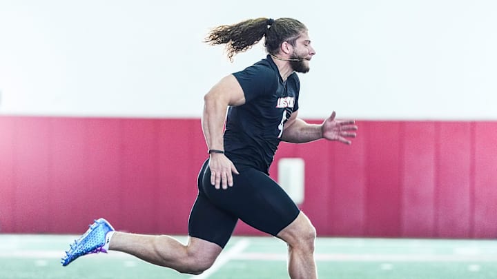 Louisville defensive end Ashton Gillotte runs a 40 yard dash during Pro Day at the UofL Football's Trager Indoor Practice Facility Tuesday, March 25, 2025. Louisville defensive end Ashton Gillotte runs a 40 yard dash during Pro Day at the UofL Football's Trager Indoor Practice Facility Tuesday, March 25, 2025.