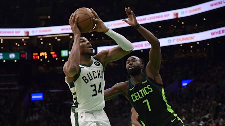 Dec 6, 2024; Boston, Massachusetts, USA;  Milwaukee Bucks forward Giannis Antetokounmpo (34) drive to the basket while Boston Celtics guard Jaylen Brown (7) defends during the first half at TD Garden. Mandatory Credit: Bob DeChiara-Imagn Images