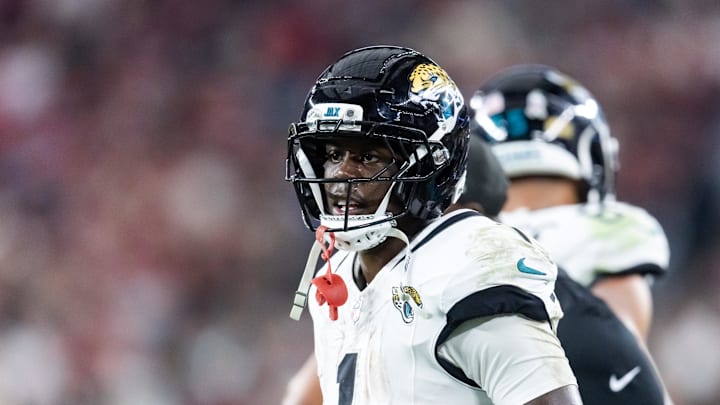 Nov 23, 2025; Glendale, Arizona, USA; Jacksonville Jaguars running back Travis Etienne Jr. (1) against the Arizona Cardinals at State Farm Stadium. Mandatory Credit: Mark J. Rebilas-Imagn Images Nov 23, 2025; Glendale, Arizona, USA; Jacksonville Jaguars running back Travis Etienne Jr. (1) against the Arizona Cardinals at State Farm Stadium. Mandatory Credit: Mark J. Rebilas-Imagn Images