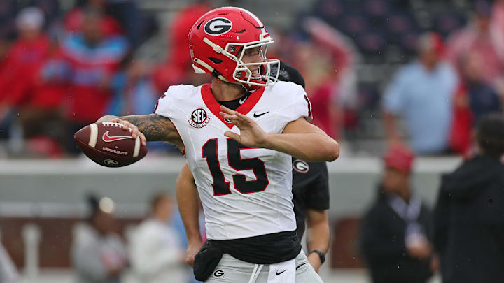 Nov 9, 2024; Oxford, Mississippi, USA; Georgia Bulldogs quarterback Carson Beck (15) passes the ball during warm ups prior to the game against the Mississippi Rebels at Vaught-Hemingway Stadium. Mandatory Credit: Petre Thomas-Imagn Images