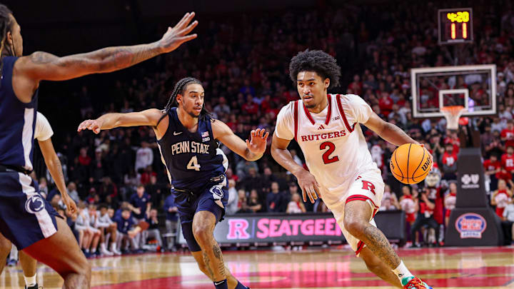 Dec 10, 2024; Piscataway, New Jersey, USA; Rutgers Scarlet Knights guard Dylan Harper (2) drives to the basket against Penn State Nittany Lions guard Freddie Dilione V (4) during the second half at Jersey Mike's Arena. Mandatory Credit: Vincent Carchietta-Imagn Images
