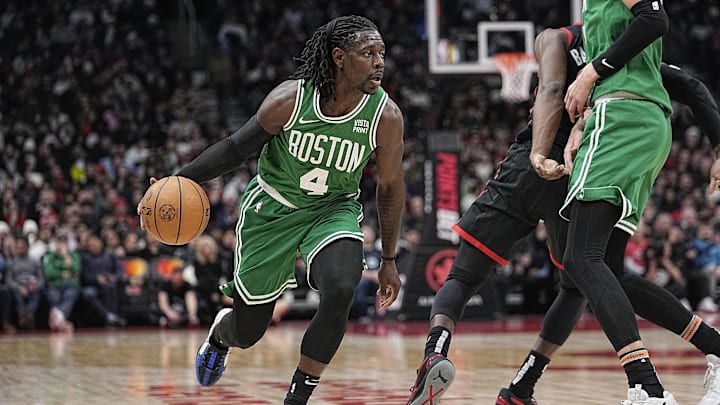 Jan 15, 2024; Toronto, Ontario, CAN; Boston Celtics guard Jrue Holiday (4) drives to the net against the Toronto Raptors during the first half at Scotiabank Arena. Mandatory Credit: John E. Sokolowski-Imagn Images