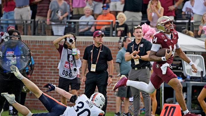 Oct 3, 2026; Tallahassee, Florida, USA;  Florida State Seminoles quarterback Ashton Daniels (14) runs for a touchdown during the second half against the Virginia Cavaliers at Doak S. Campbell Stadium.  Mandatory Credit: Melina Myers-Imagn Images