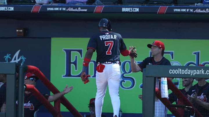 Mar 2, 2025; North Port, Florida, USA; Atlanta Braves outfielder Jurickson Profar (7) is congratulated after he scored a run during the third inning against the New York Yankees  at CoolToday Park. Mandatory Credit: Kim Klement Neitzel-Imagn Images