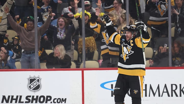 Mar 30, 2025; Pittsburgh, Pennsylvania, USA;  Pittsburgh Penguins center Sidney Crosby (87) reacts after scoring the game winning power play goal in overtime against the Ottawa Senators at PPG Paints Arena. Mandatory Credit: Charles LeClaire-Imagn Images