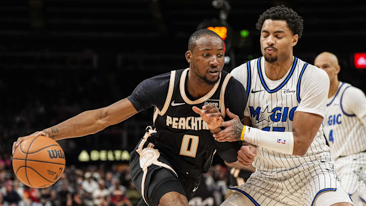 Mar 16, 2026; Atlanta, Georgia, USA; Atlanta Hawks forward Jonathan Kuminga (0) dribbles against Orlando Magic guard Jett Howard (13) during the second half at State Farm Arena. Mandatory Credit: Dale Zanine-Imagn Images Mar 16, 2026; Atlanta, Georgia, USA; Atlanta Hawks forward Jonathan Kuminga (0) dribbles against Orlando Magic guard Jett Howard (13) during the second half at State Farm Arena. Mandatory Credit: Dale Zanine-Imagn Images