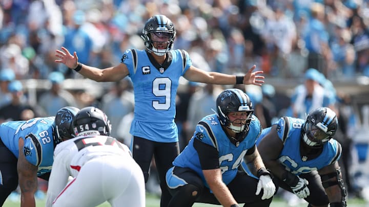 Sep 21, 2025; Charlotte, North Carolina, USA; Carolina Panthers quarterback Bryce Young (9) calls a play while center Cade Mays (64) readies to snap the ball during the second half of a game against the Atlanta Falcons at Bank of America Stadium. Mandatory Credit: Cory Knowlton-Imagn Images Sep 21, 2025; Charlotte, North Carolina, USA; Carolina Panthers quarterback Bryce Young (9) calls a play while center Cade Mays (64) readies to snap the ball during the second half of a game against the Atlanta Falcons at Bank of America Stadium. Mandatory Credit: Cory Knowlton-Imagn Images