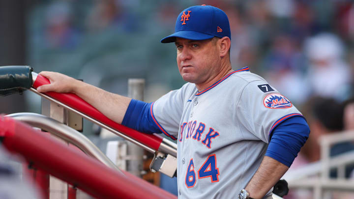 Jun 19, 2025; Atlanta, Georgia, USA; New York Mets manager Carlos Mendoza (64) in the dugout before a game against the Atlanta Braves at Truist Park. Mandatory Credit: Brett Davis-Imagn Images