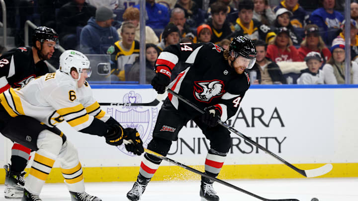 Dec 27, 2025; Buffalo, New York, USA; Boston Bruins defenseman Mason Lohrei (6) defends as Buffalo Sabres center Josh Dunne (44) tries to control the puck during the second period at KeyBank Center. Mandatory Credit: Timothy T. Ludwig-Imagn Images Dec 27, 2025; Buffalo, New York, USA; Boston Bruins defenseman Mason Lohrei (6) defends as Buffalo Sabres center Josh Dunne (44) tries to control the puck during the second period at KeyBank Center. Mandatory Credit: Timothy T. Ludwig-Imagn Images