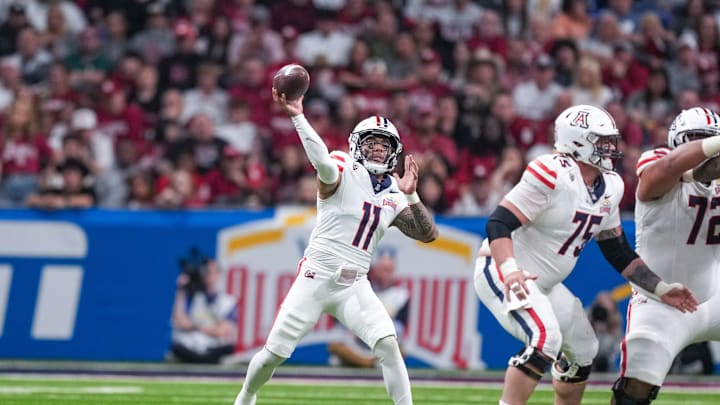 Dec 28, 2023; San Antonio, TX, USA;  Arizona Wildcats quarterback Noah Fifita (11) throws a pass against the Oklahoma Sooners in the first half at Alamodome. Mandatory Credit: Daniel Dunn-USA TODAY Sports