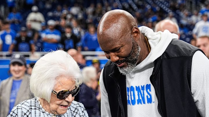 Martha Ford talks to general manager Brad Holmes during warm up at Ford Field in Detroit on Sunday, Sept. 14, 2025.