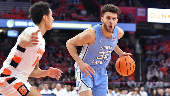 Jan 24, 2023; Syracuse, New York, USA; North Carolina Tar Heels forward Pete Nance (32) tries to move past Syracuse Orange center Jesse Edwards (14) in the first half at JMA Wireless Dome. Mandatory Credit: Mark Konezny-Imagn Images Jan 24, 2023; Syracuse, New York, USA; North Carolina Tar Heels forward Pete Nance (32) tries to move past Syracuse Orange center Jesse Edwards (14) in the first half at JMA Wireless Dome. Mandatory Credit: Mark Konezny-Imagn Images