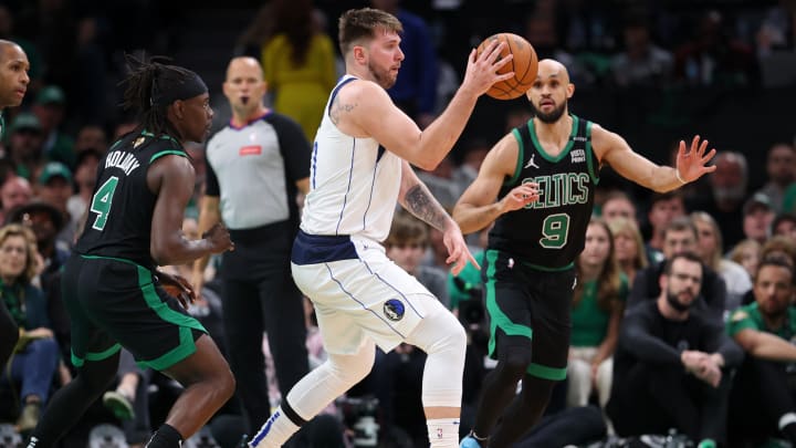 Jun 9, 2024; Boston, Massachusetts, USA; Dallas Mavericks guard Luka Doncic (77) passes the ball against the Boston Celtics during the third quarter in game two of the 2024 NBA Finals at TD Garden. Mandatory Credit: Peter Casey-USA TODAY Sports