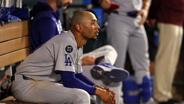 Aug 13, 2025; Anaheim, California, USA;  Los Angeles Dodgers shortstop Mookie Betts (50) looks on in the dugout during the ninth inning against the Los Angeles Angels at Angel Stadium. Mandatory Credit: Kiyoshi Mio-Imagn Images