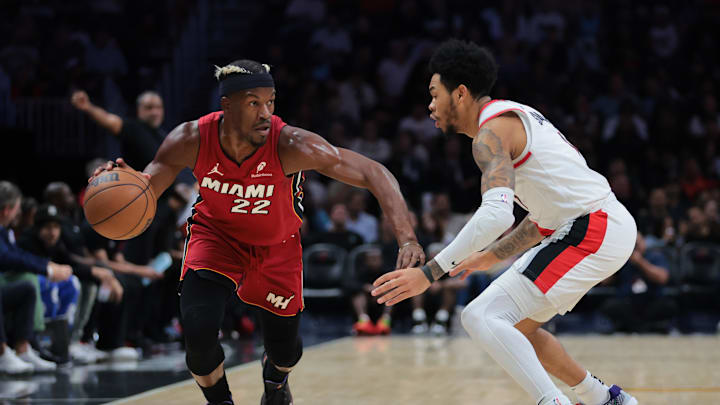 Jan 21, 2025; Miami, Florida, USA; Miami Heat forward Jimmy Butler (22) drives to the basket past Portland Trail Blazers guard Anfernee Simons (1) during the first quarter at Kaseya Center. Mandatory Credit: Sam Navarro-Imagn Images Jan 21, 2025; Miami, Florida, USA; Miami Heat forward Jimmy Butler (22) drives to the basket past Portland Trail Blazers guard Anfernee Simons (1) during the first quarter at Kaseya Center. Mandatory Credit: Sam Navarro-Imagn Images