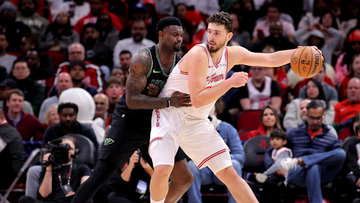Jan 18, 2026; Houston, Texas, USA; Houston Rockets center Alperen Sengun (28) dribbles against New Orleans Pelicans forward Zion Williamson (1) during the fourth quarter at Toyota Center. Mandatory Credit: Erik Williams-Imagn Images