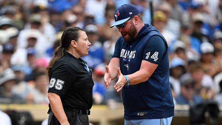 Toronto Blue Jays manager John Schneider argues with an umpire. Toronto Blue Jays manager John Schneider argues with an umpire.