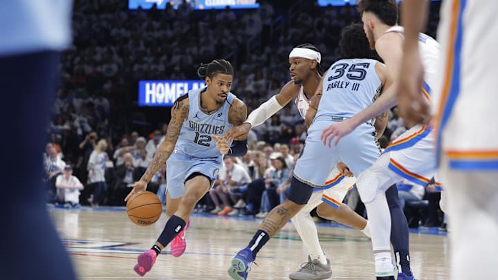 Memphis Grizzlies guard Ja Morant (12) dribbles around Oklahoma City Thunder guard Shai Gilgeous-Alexander (2) during the second half at Paycom Center. Mandatory Credit: Alonzo Adams-Imagn Images Memphis Grizzlies guard Ja Morant (12) dribbles around Oklahoma City Thunder guard Shai Gilgeous-Alexander (2) during the second half at Paycom Center. Mandatory Credit: Alonzo Adams-Imagn Images