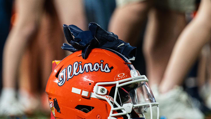Dec 31, 2024; Orlando, FL, USA; A Illinois Fighting Illini helmet sitting on confetti after the game against the South Carolina Gamecocks at Camping World Stadium. Mandatory Credit: Jeremy Reper-Imagn Images Dec 31, 2024; Orlando, FL, USA; A Illinois Fighting Illini helmet sitting on confetti after the game against the South Carolina Gamecocks at Camping World Stadium. Mandatory Credit: Jeremy Reper-Imagn Images