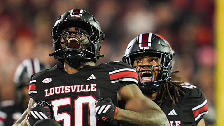 Louisville Cardinals defensive lineman Clev Lubin (50) celebrates his tackle of Clemson Tigers quarterback Cade Klubnik (2) in the first half at L&N Stadium Friday, Nov. 14, 2025.