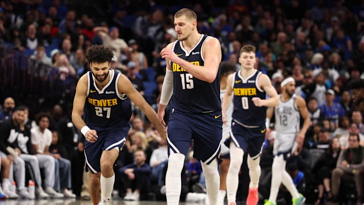 Jan 19, 2025; Orlando, Florida, USA; Denver Nuggets guard Jamal Murray (27) celebrates with center Nikola Jokic (15) after a basket against the Orlando Magic in the third quarter at Kia Center. Mandatory Credit: Nathan Ray Seebeck-Imagn Images